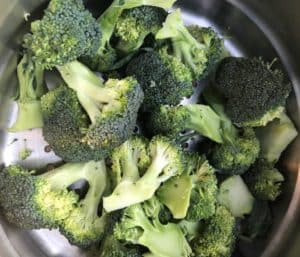 chopped broccoli in steamer