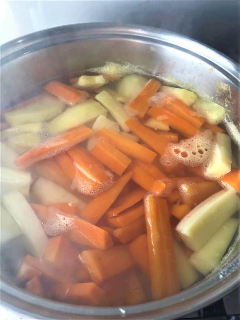 potatoes carrots parsnips in pan