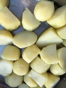 Potatoes in roasting tray