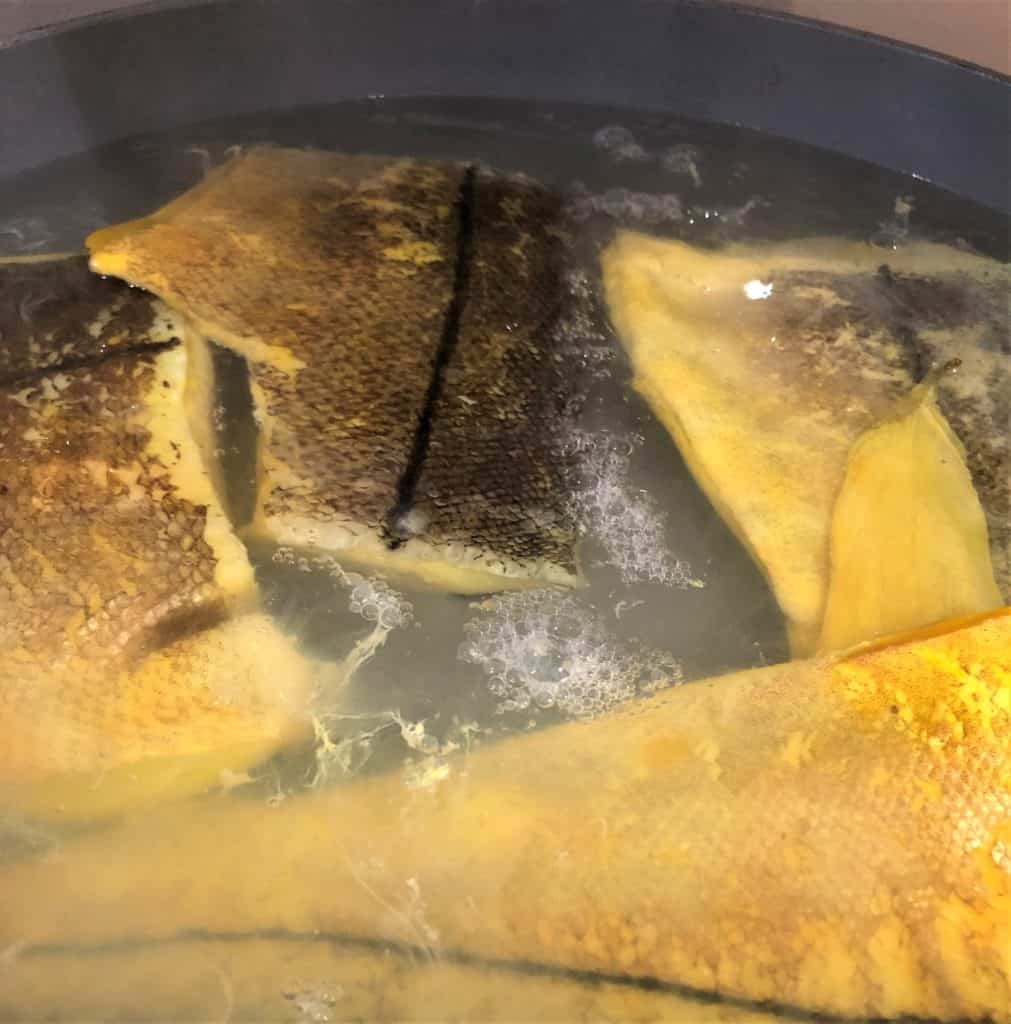 smoked haddock boiling in pan