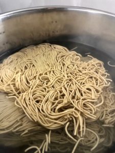 winter veg stir fry step 1 noodles in pan