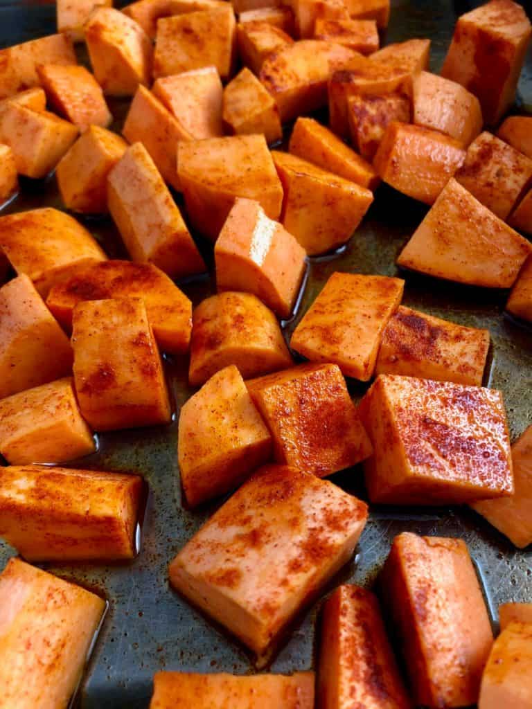 diced sweet potato in tray with sweet smoked paprika