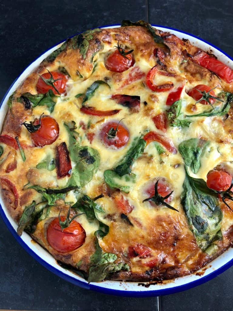 crustess quiche cooked with tomatoes spinach red pepper