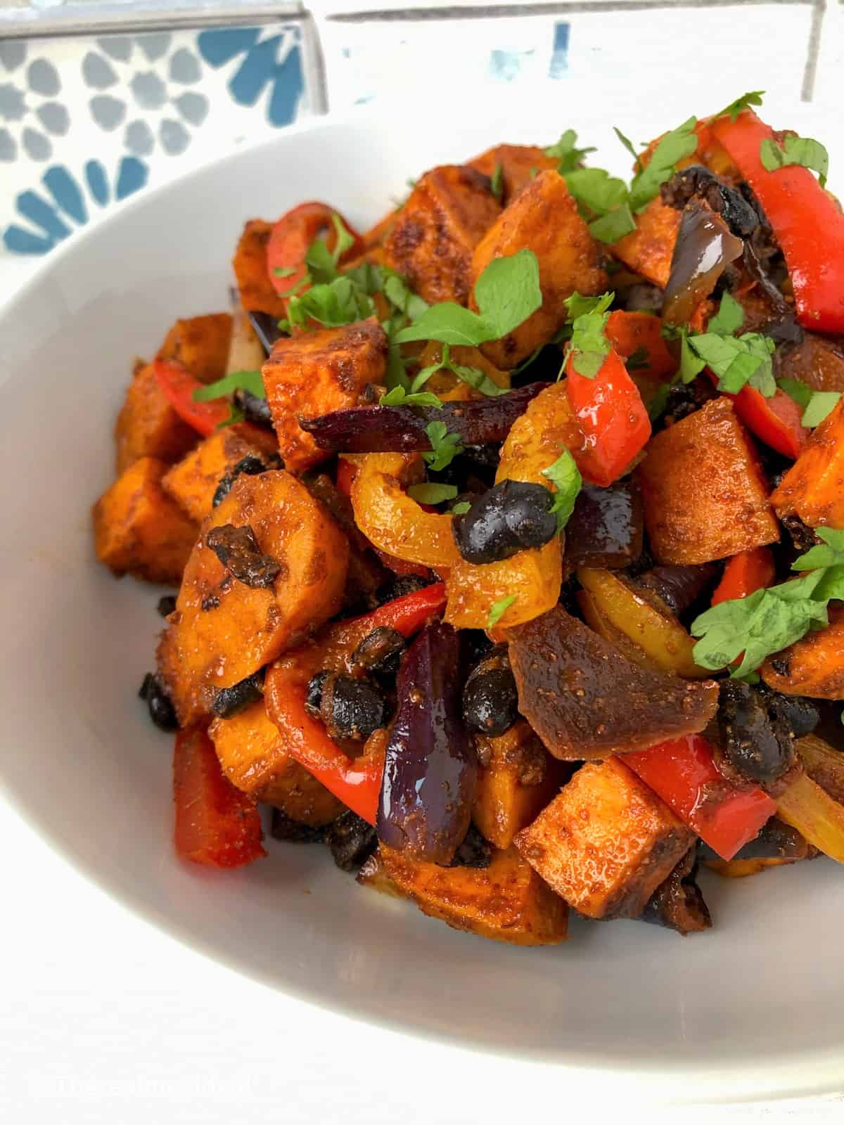 roasted sweet potato peppers red onion black beans in bowl