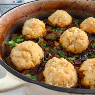 beef stew and dumplings in casserole pot