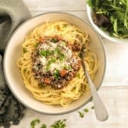 spaghetti bolognaise sauce in bowl with spaghetti