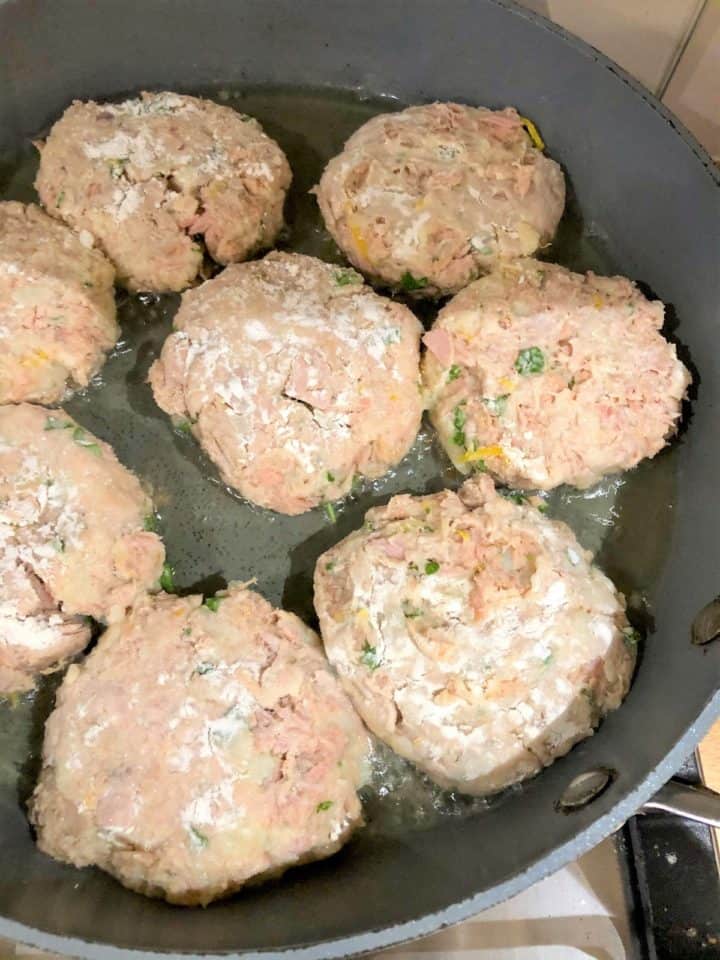 tuna fishcakes frying in pan