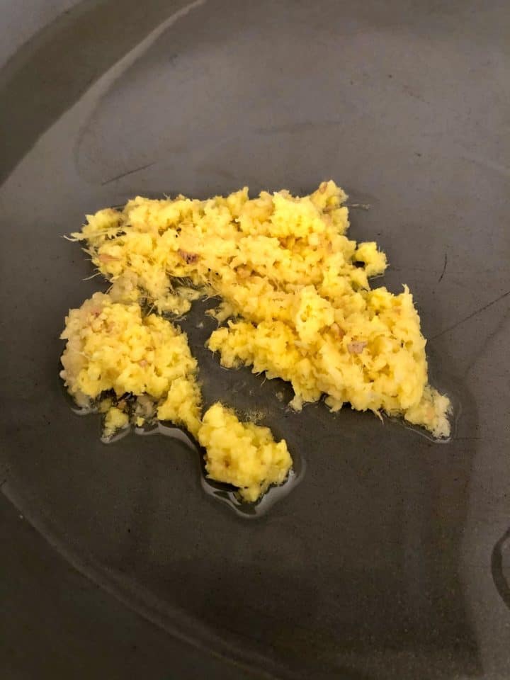 crushed garlic and ginger frying in pan