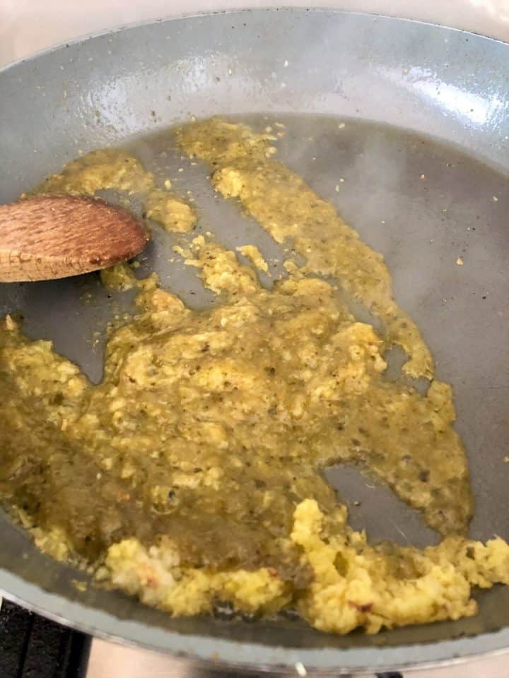crushed garlic ginger and thai green curry paste frying in pan