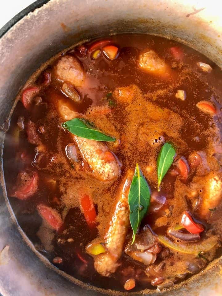tomatoes, baked beans, stock red wine worchestershire sauce and bay leaves added to sausae casserole