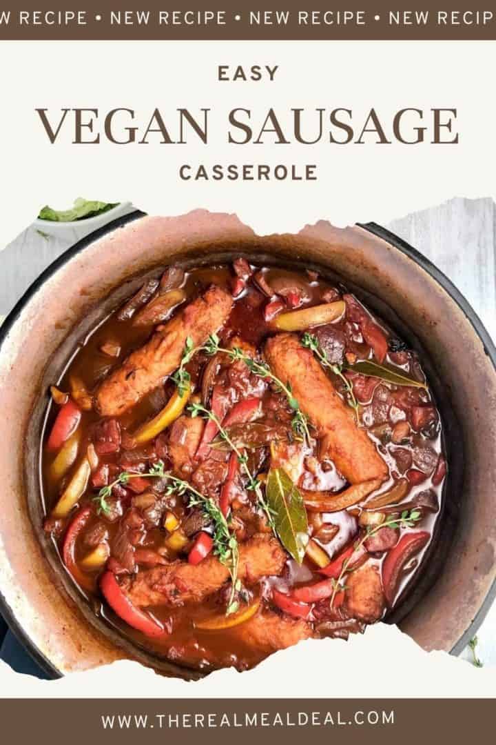 close up of vegan sausage casserole in dish topped with fresh thyme