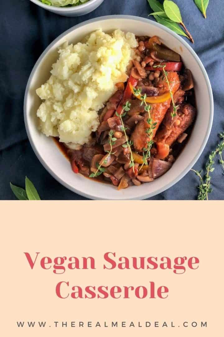 sausage casserole in bowl with mashed potato and topped with fresh thyme