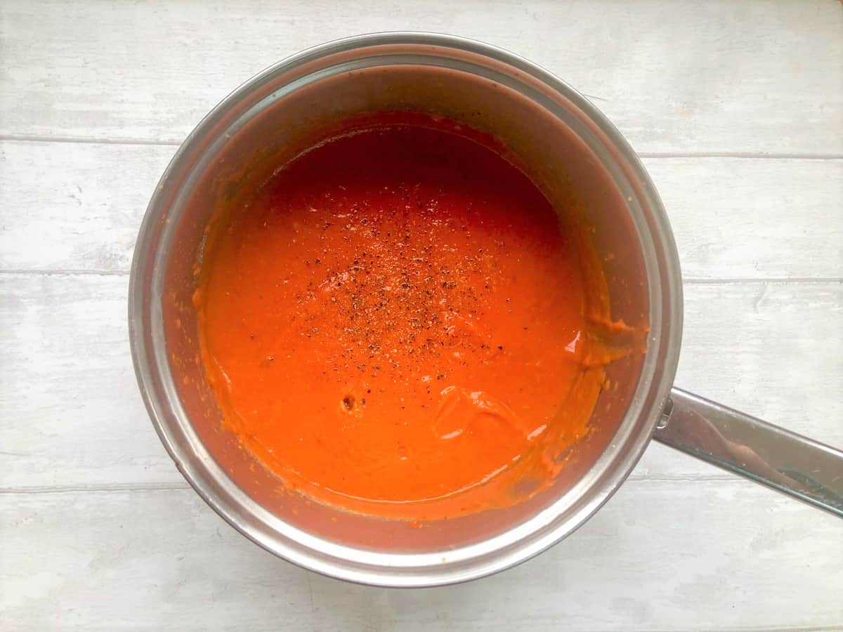 blended red lentil soup in a pan
