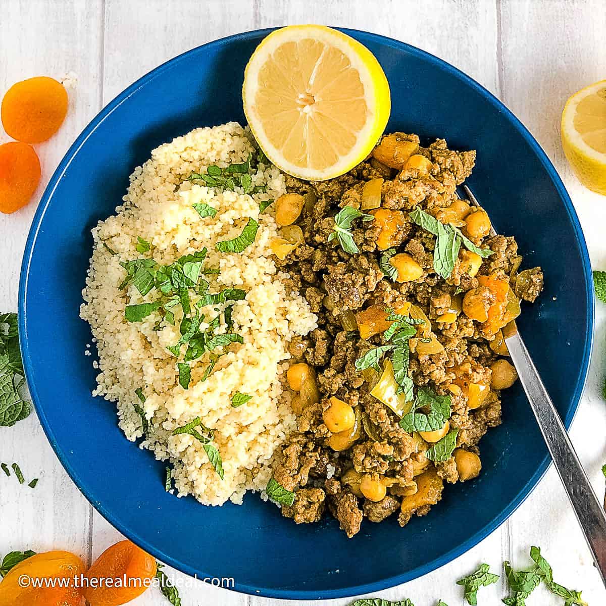 Moroccan fruity lamb tagine in bowl with couscous