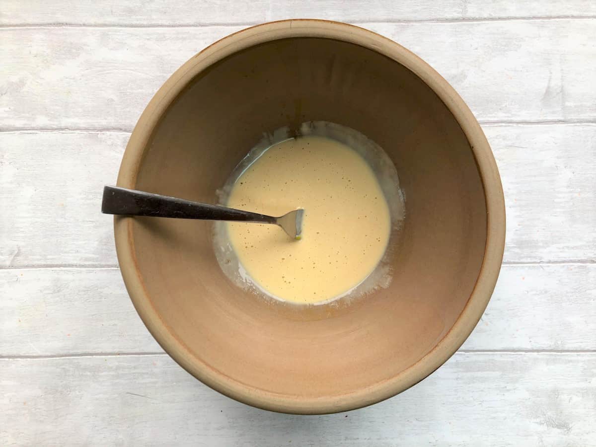 egg yolk and creme fraiche mixed together in a bowl
