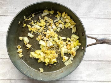 onion garlic and ginger in frying pan