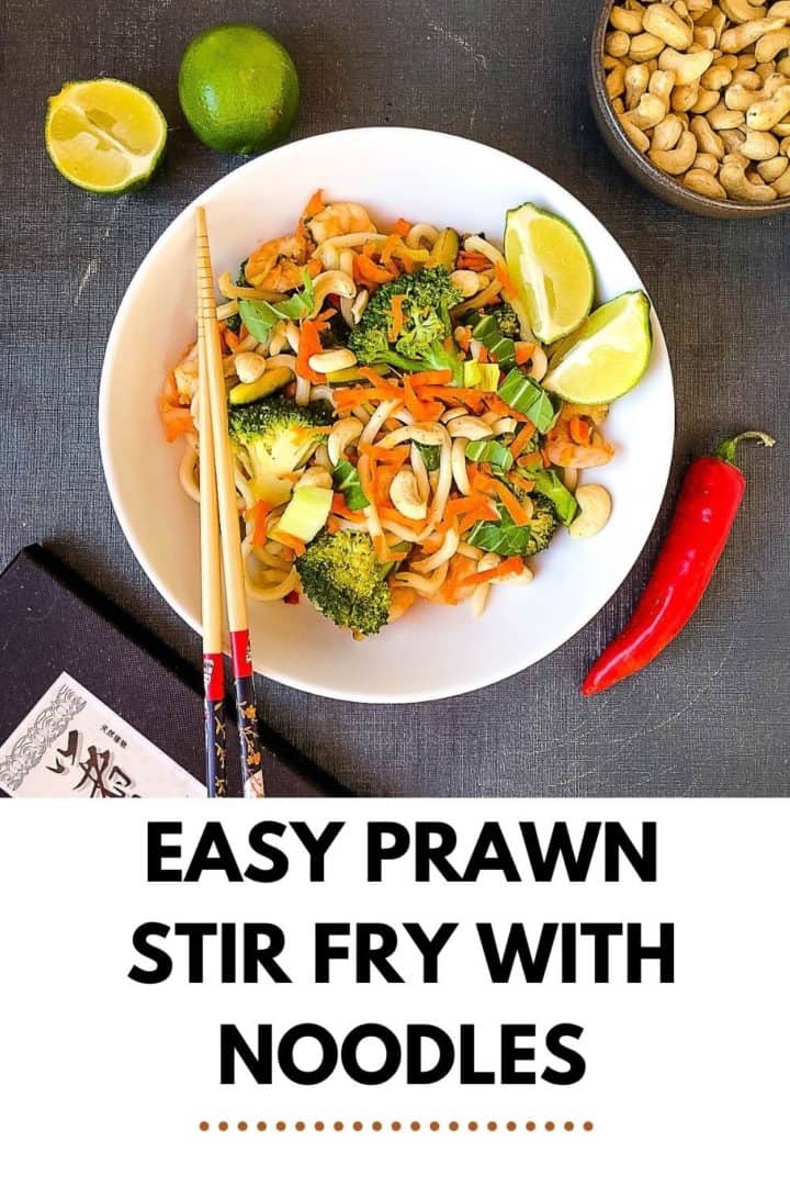 pinterest image prawn stir fry with noodles showing bowl of stir fry with chop sticks and cashew nuts