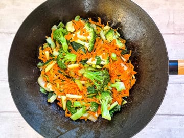 carrots and broccoli added to wok with pak choi and courgette.