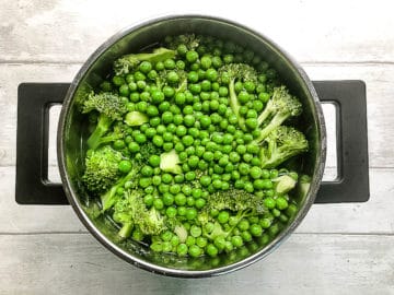 broccoli and peas in pan