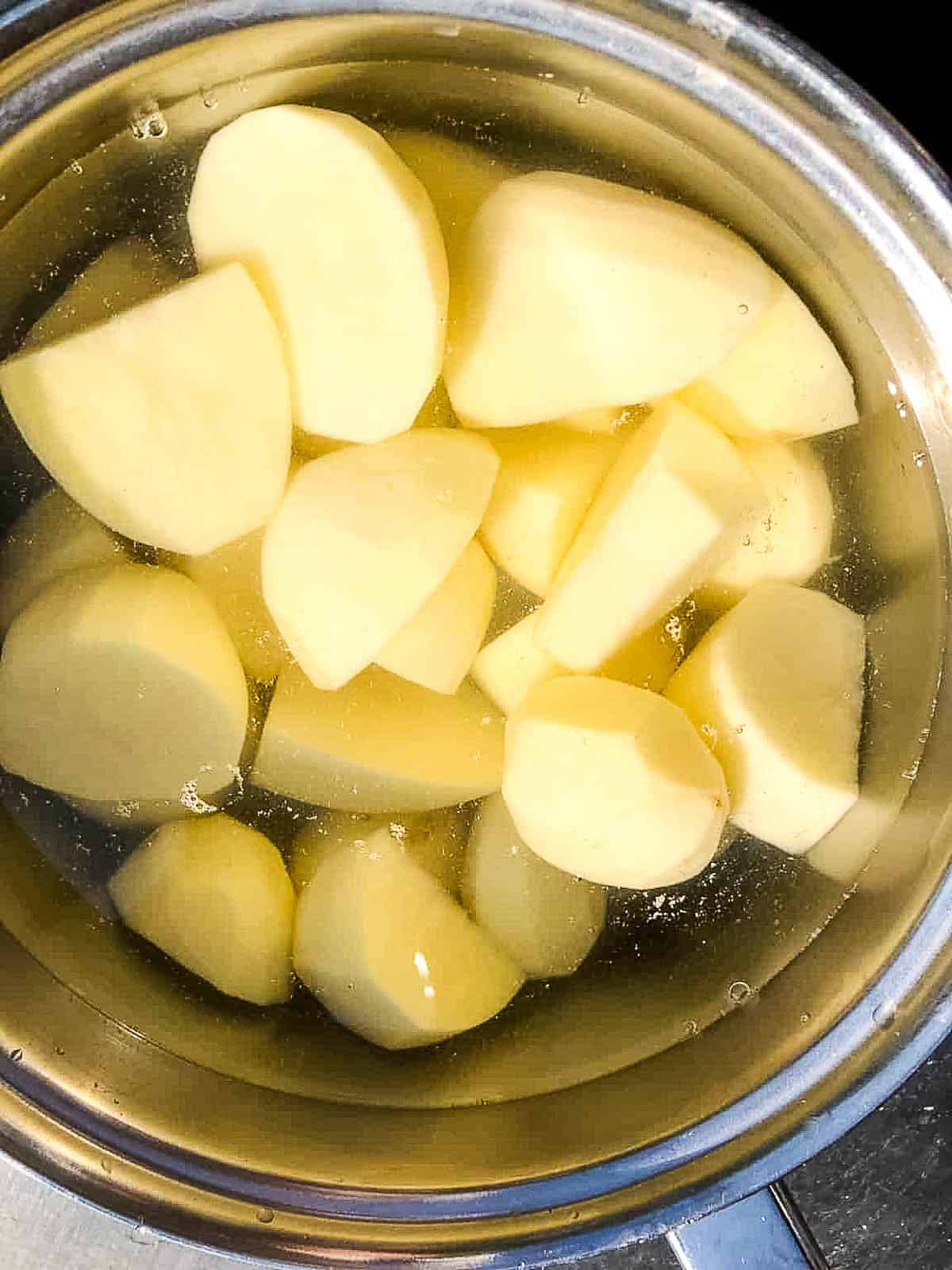 peeled potatoes in pan.
