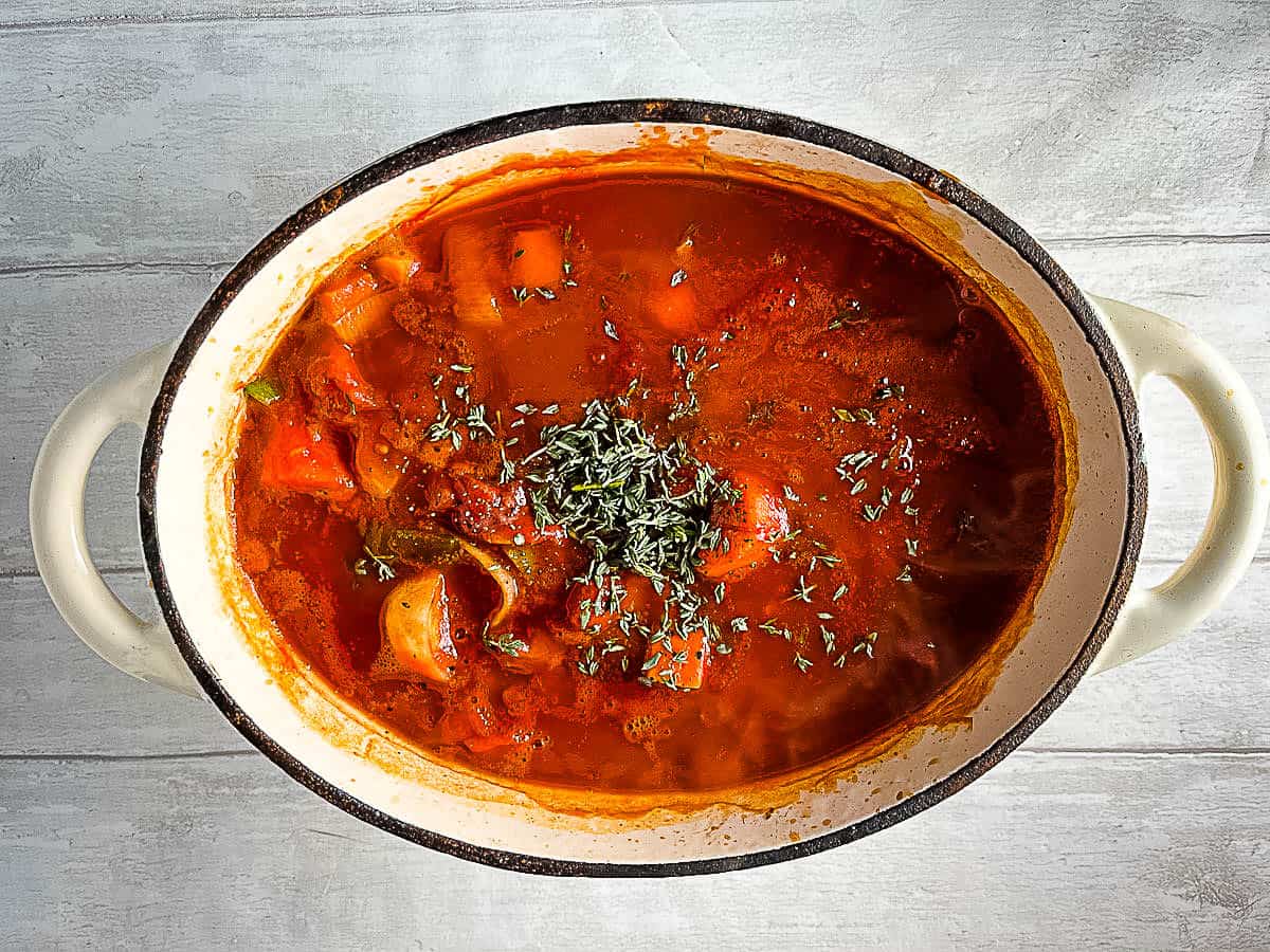 tomato sauce added to vegetables for vegan stew