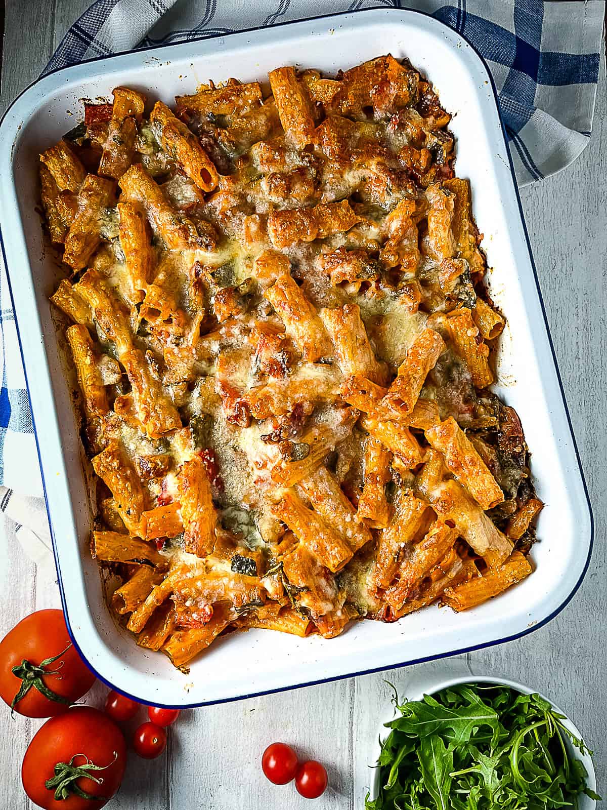 vegetable and pesto pasta bake in dish ready to serve