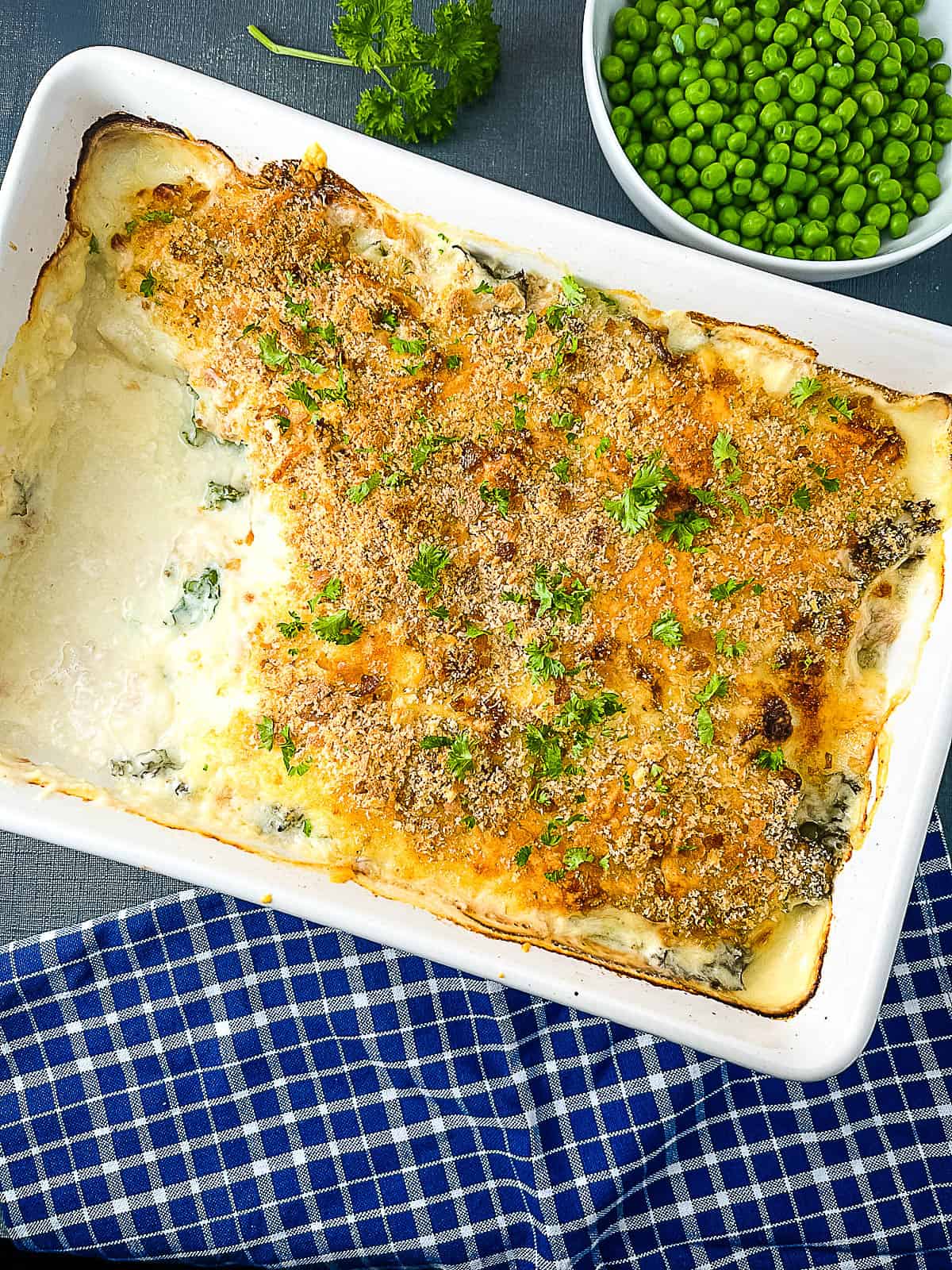 baked cod mornay with side of peas