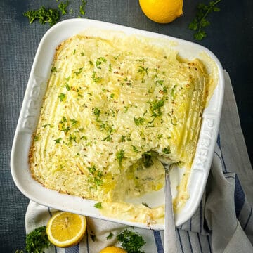 baked fish pie with leeks with portion removed