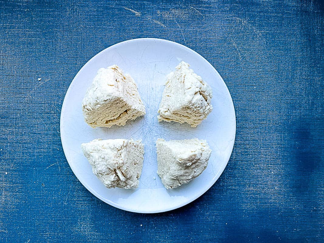 flatbread dough divided into four