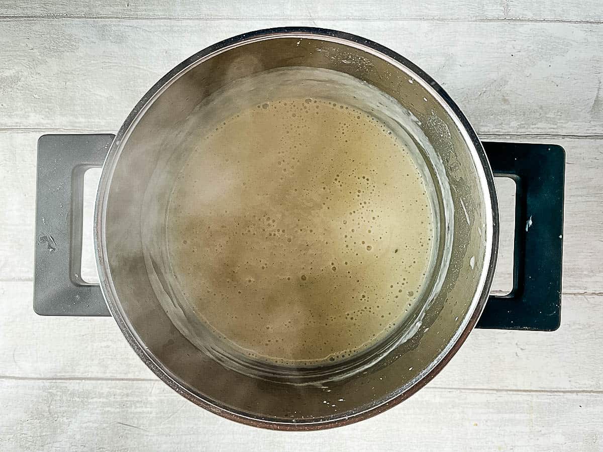 cheese sauce simmering in pan