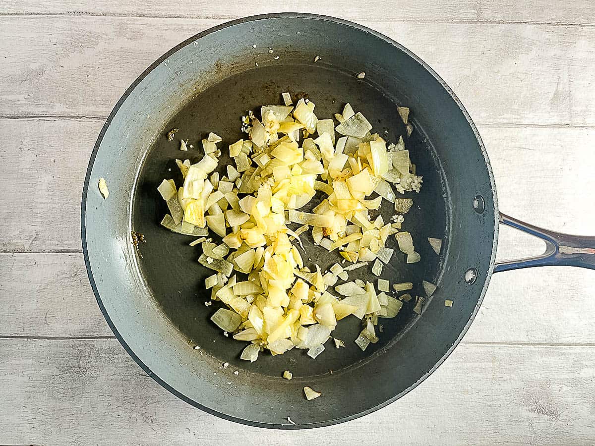 onions and garlic frying in pan