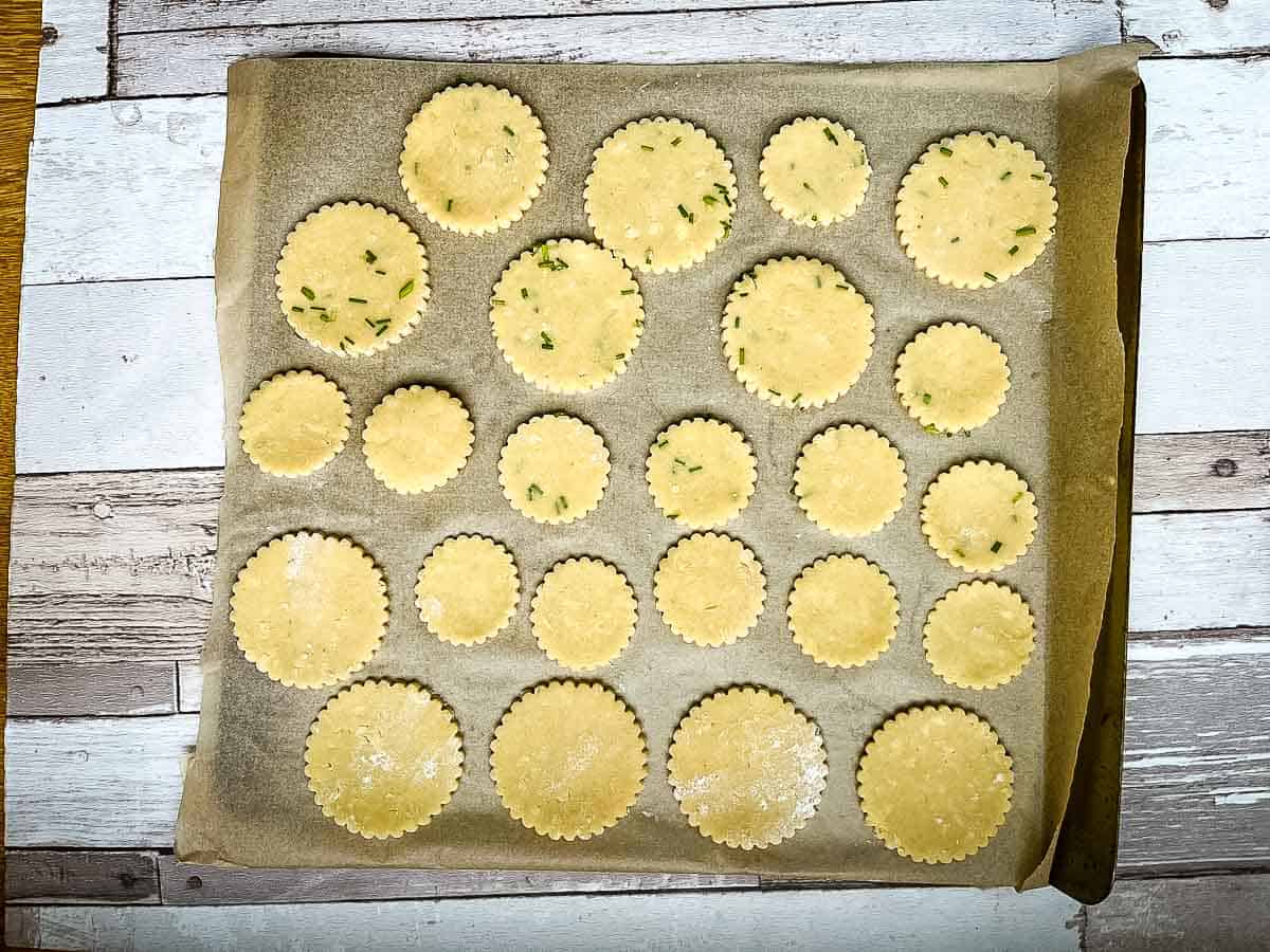 cheese pastry dough with chives on baking tray ready for the oven.