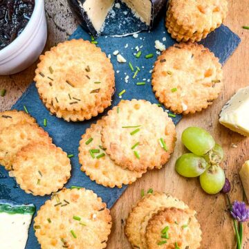 cheese biscuits served with chutney grapes and cheese.