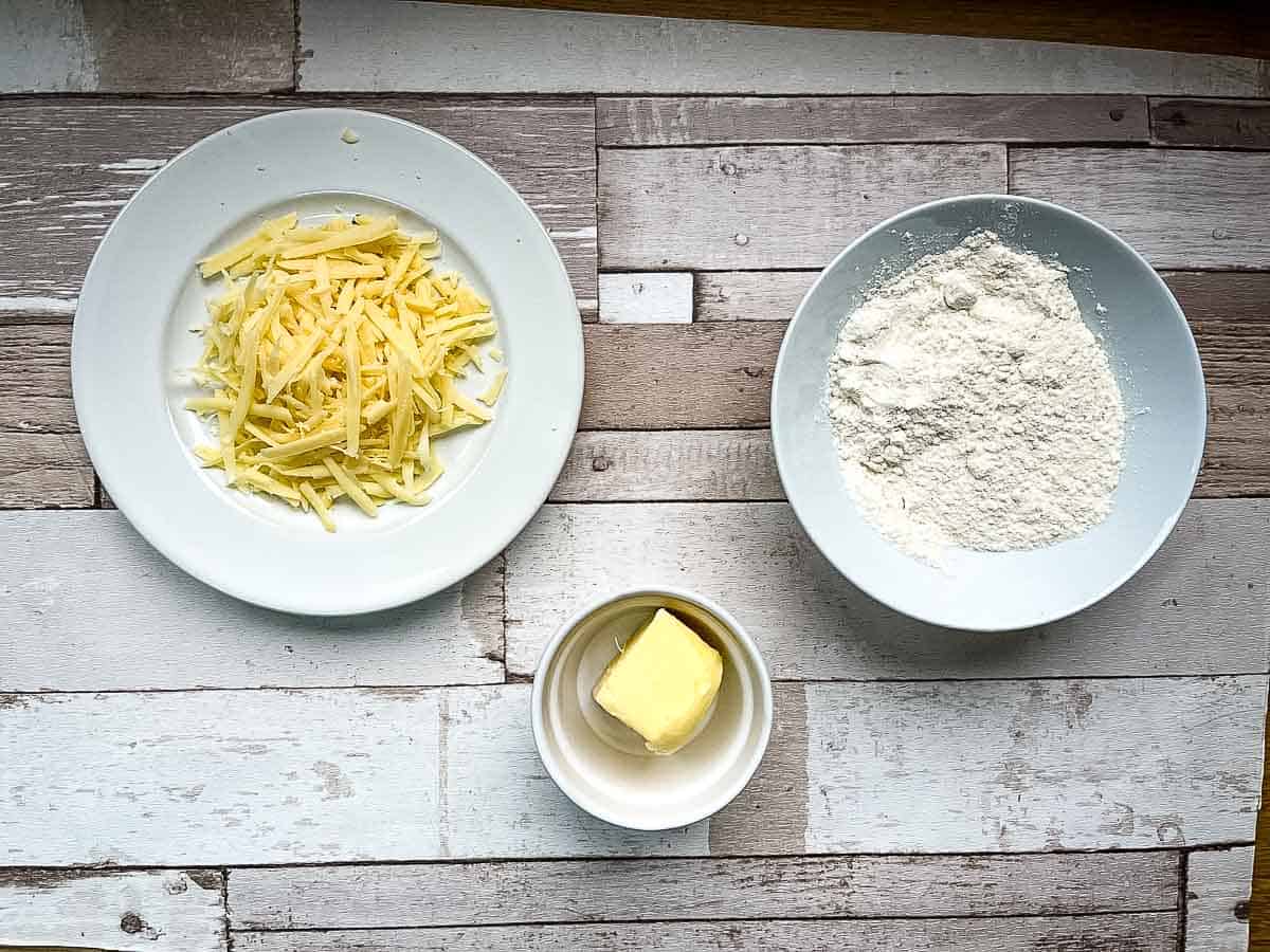 grated cheese, plain flour and butter ingredients for cheesy bites.