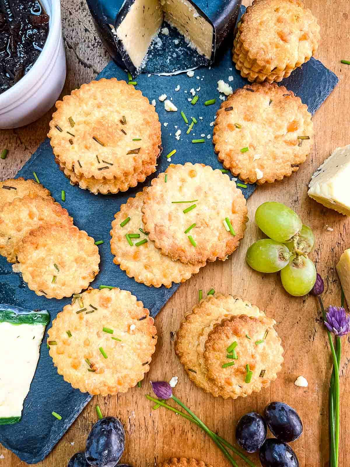 cheese biscuits with chives served with chutney, grapes and cheese.