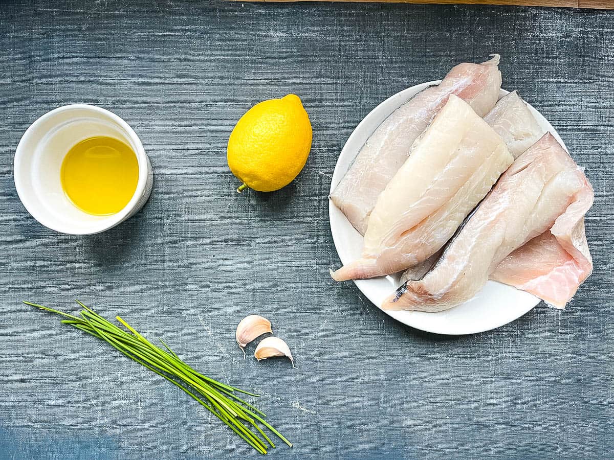 haddock fillets olive oil garlic cloves lemonand chives ready for grilled haddock recipe