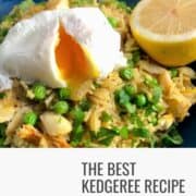 kedgeree in dish topped with soft boiled egg and half a lemon and fresh parsley.