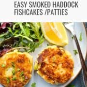 two smoked haddock fishcakes on a plate with salad