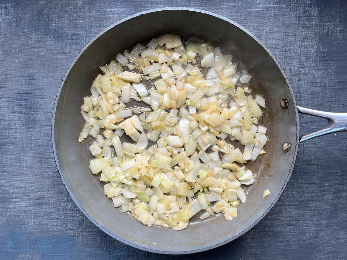 diced onions in frying pan.
