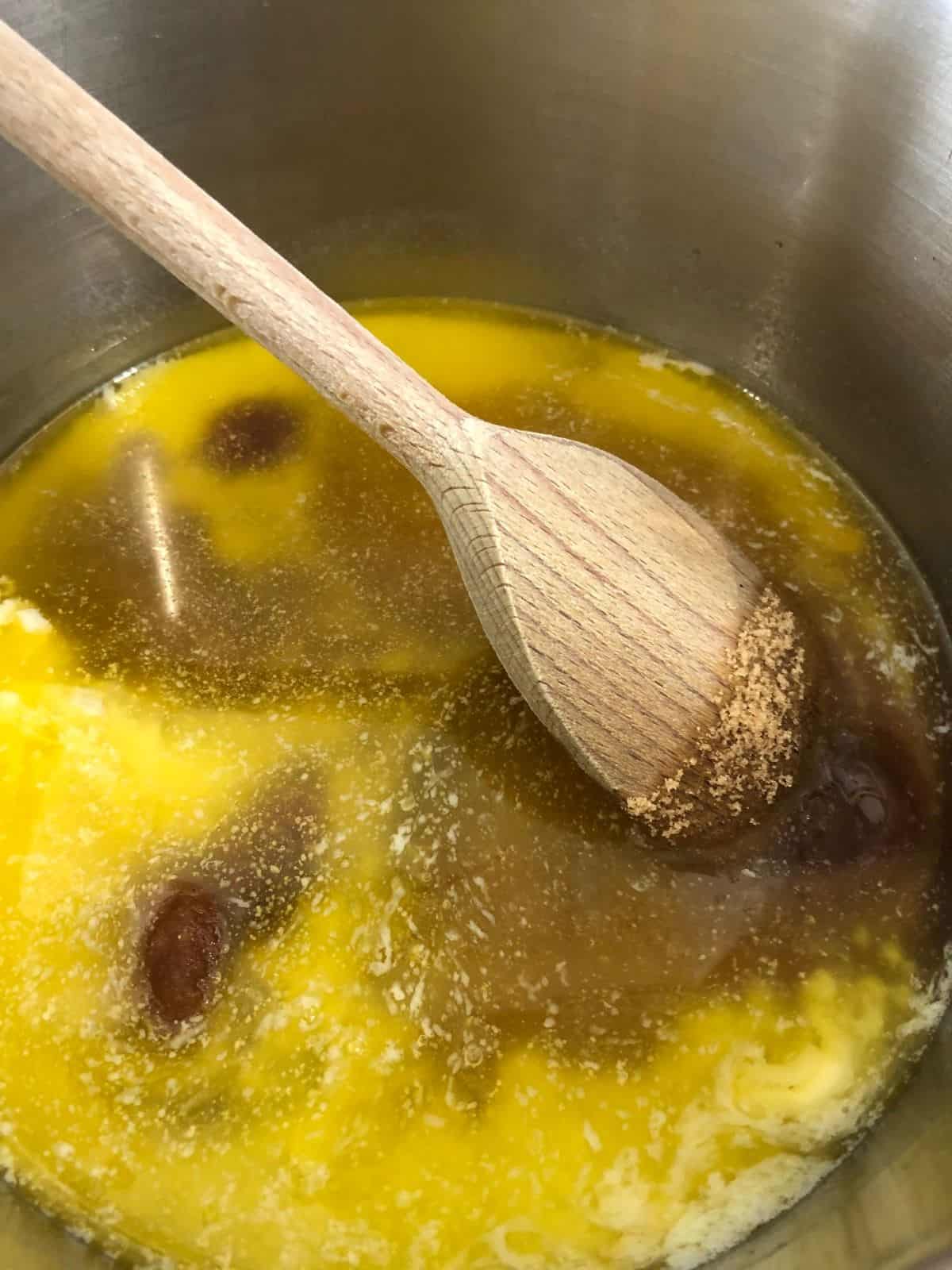 butter golden syrup and sugar melting in pan.