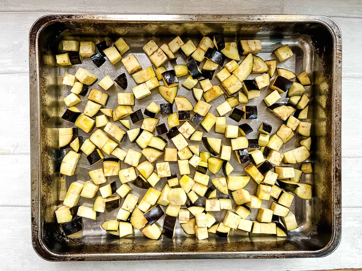 diced aubergine in roasting tray.