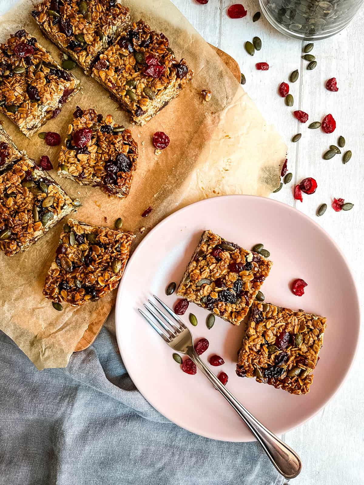 baked granola flapjacks on plate and board.