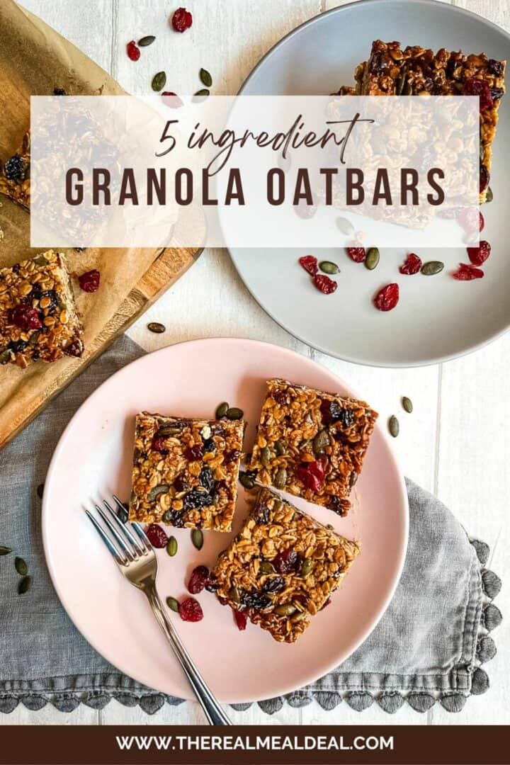granola flapjack bars on plates with pumpkin seeds and dried cranberries.
