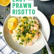 prawn risotto with peas and lemon in a bowl