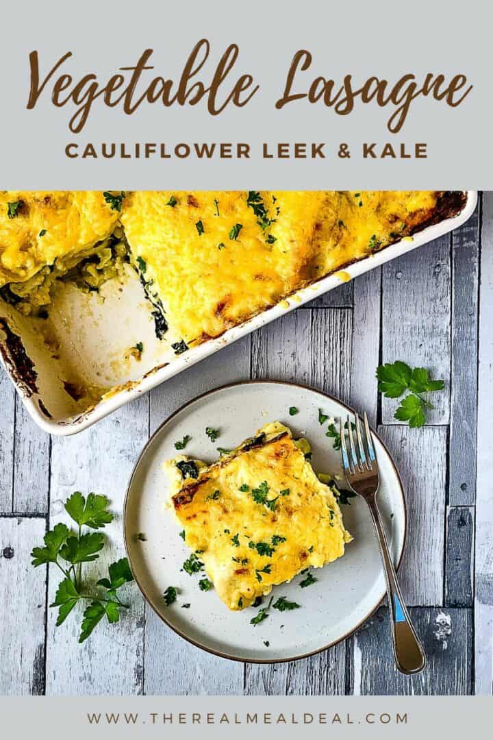 portion of cauliflower leek and kale lasagne on plate nect to tray with remainder of lasagne.