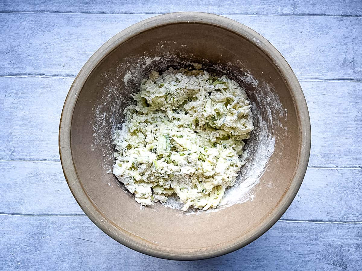 courgette cheese and flour in a bowl