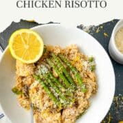 pinterest image for asparagus and chicken risotto served in a bowl topped with asparagus tips and lemon zest