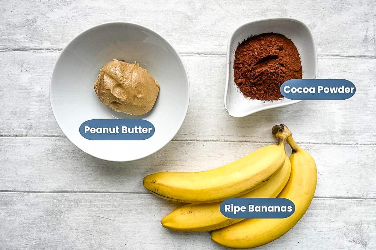 ingredients for peanut butter and banana brownies, peanut butter, cocoa powder and ripe bananas.
