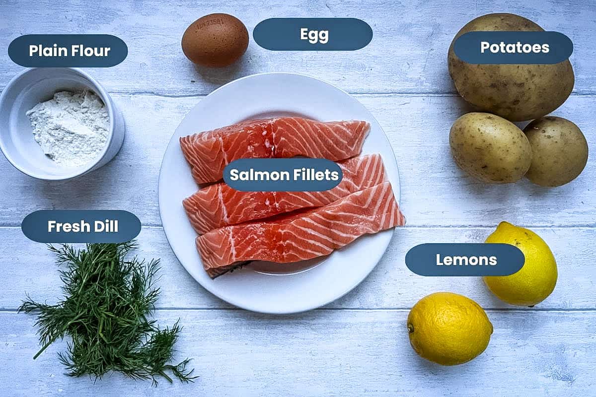 labelled ingredients for salmon and dill fishcakes salmon fillets, potatoes, egg, lemons, plain four, fresh dill.