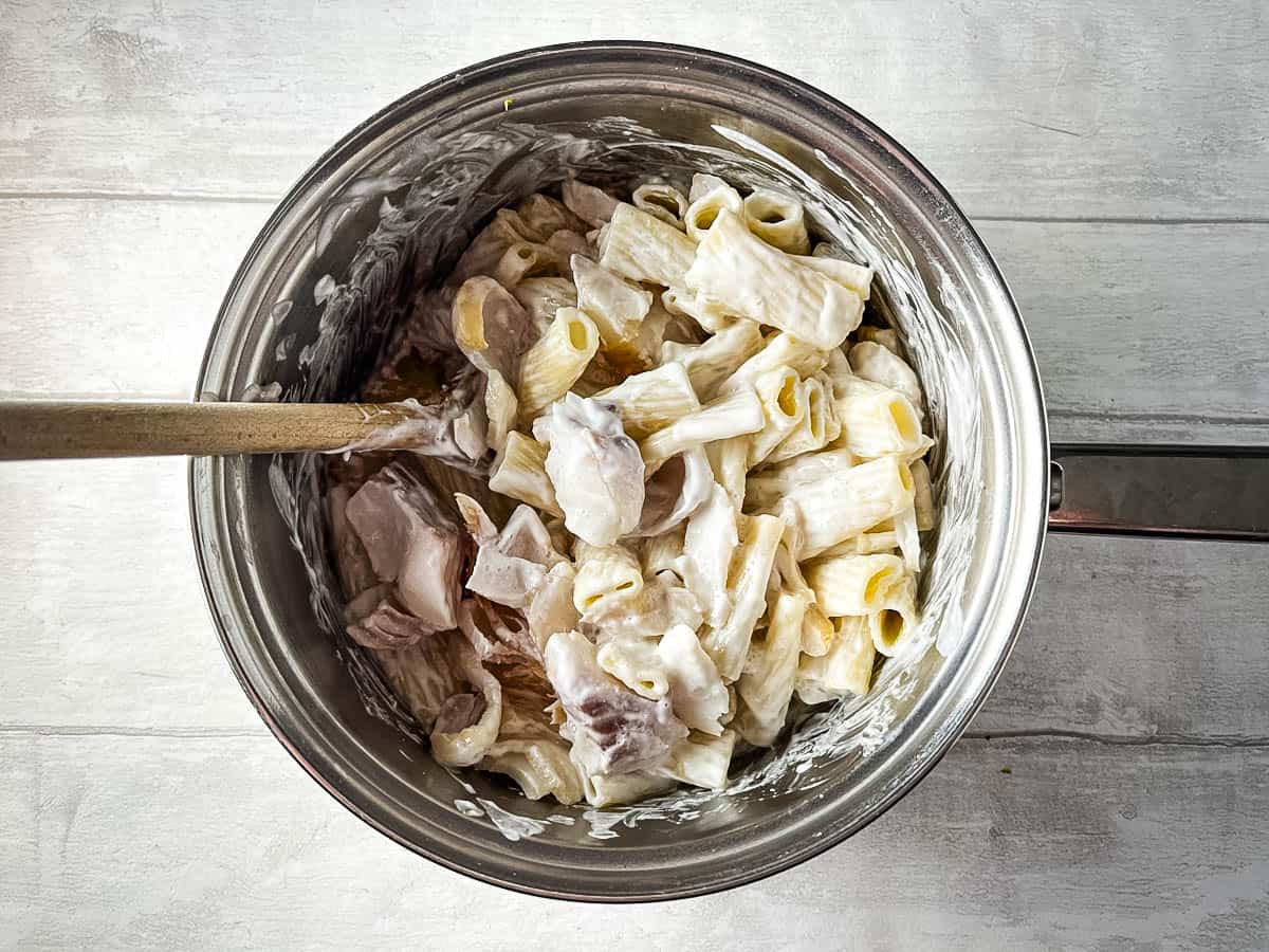 pasta smoked haddock yoghurt and lemon stirred together in a pan.